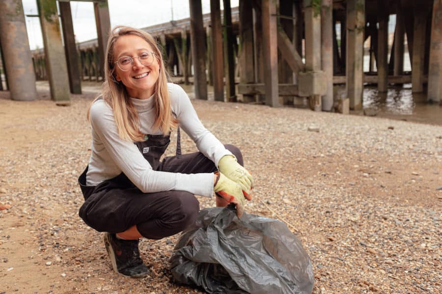 Flora with some of the plastic she has collected from the Thames' beaches