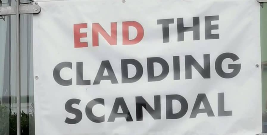 A protest banner hanging from Peckham's Cooperative House, an L&Q block affected by cladding