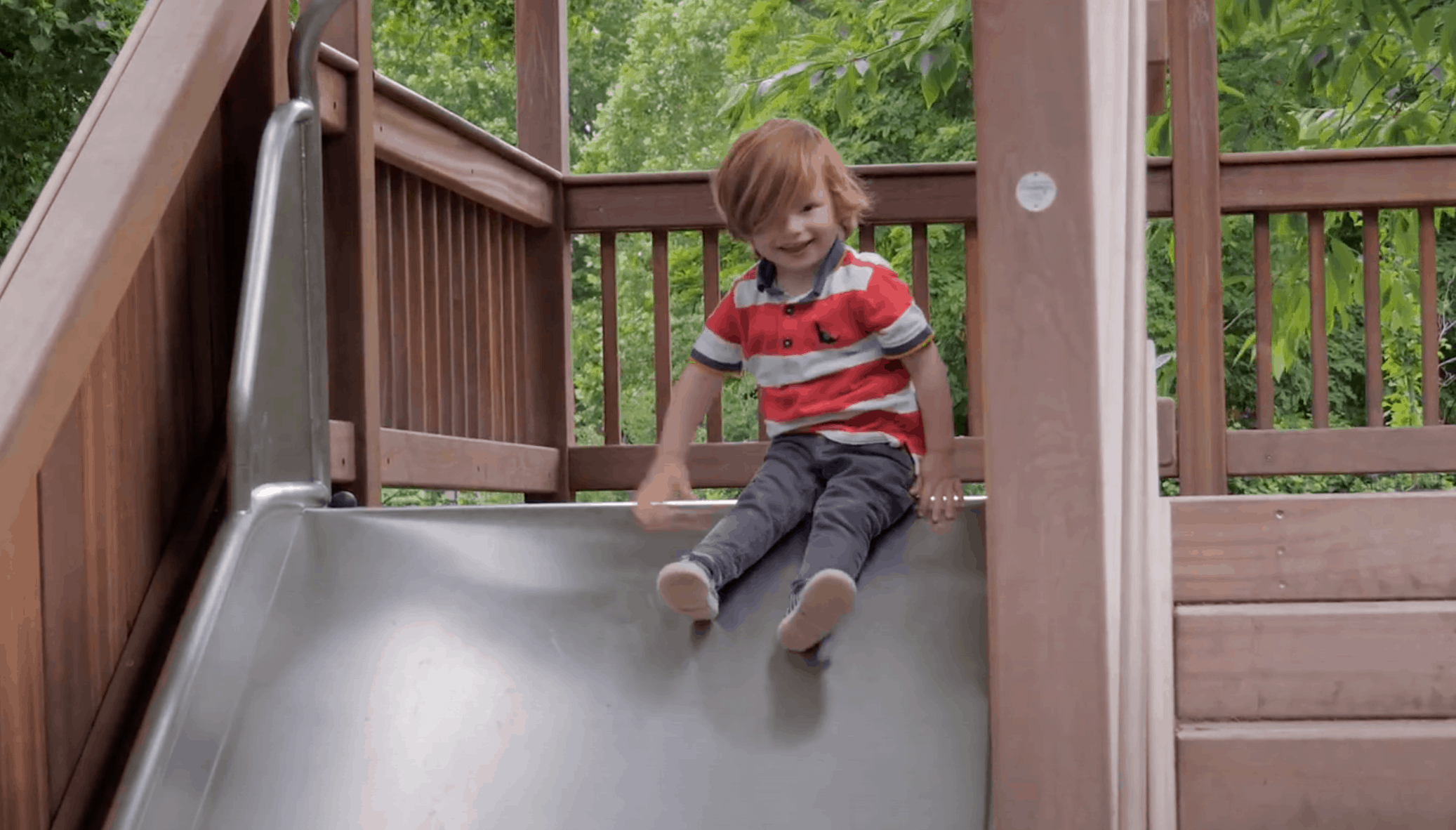 A child playing on the joy slide