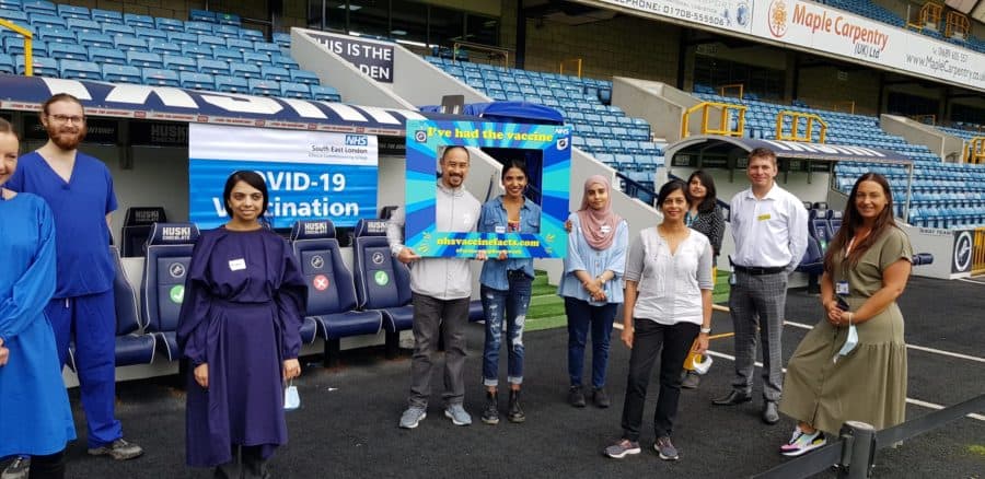 Volunteers and newly vaccinated residents at a mass vaccination event at Millwall last weekend