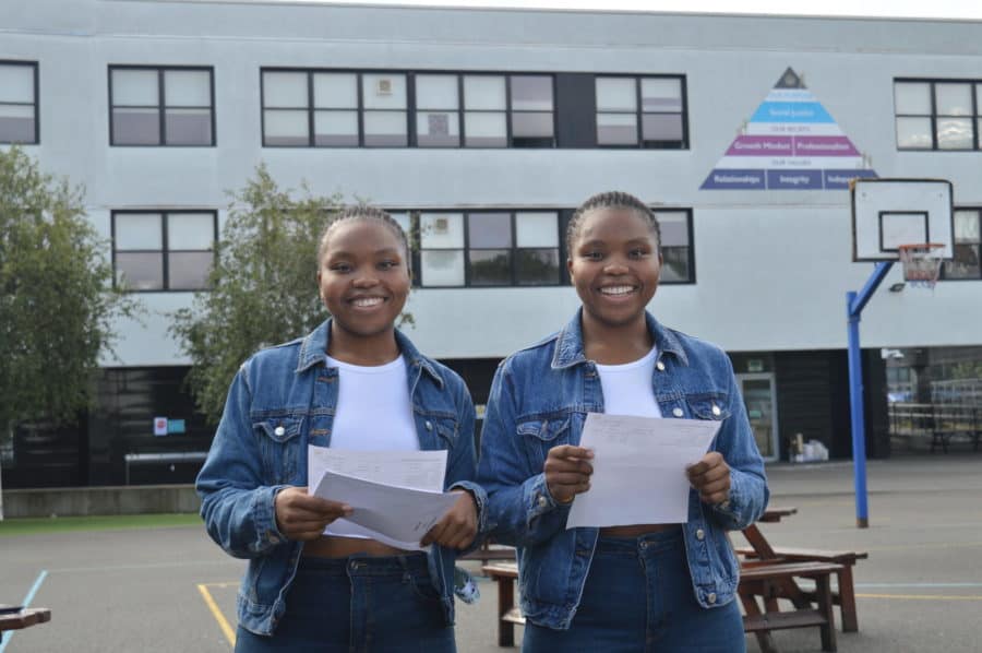 Twins Kehinde and Deborah collecting their results