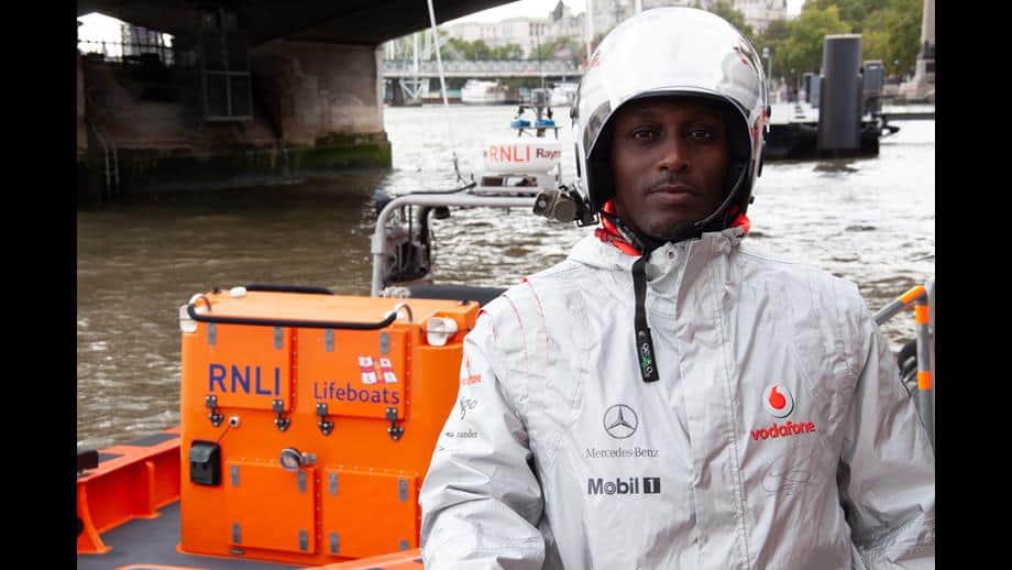 Tower volunteer crew member Nazrawi Mamoneh wearing the Lewis Hamilton signed jacket