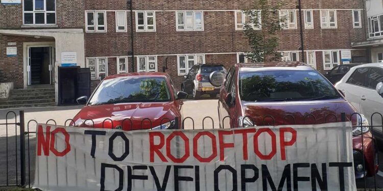 A banner against proposed rooftop homes on the Nunhead Estate
