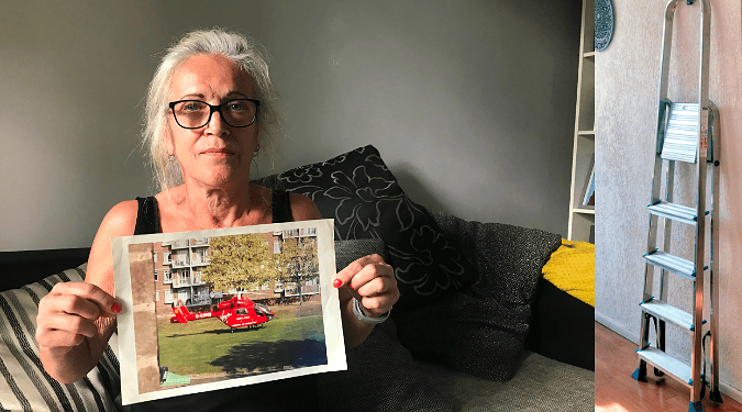 Christine holds a photo of the air ambulance that whisked her away