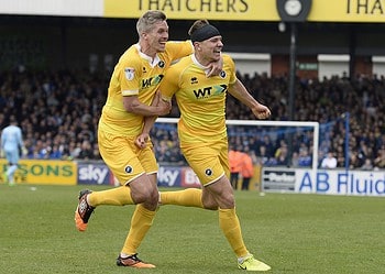 Shaun Hutchinson celebrates with Steve Morison after his winner against Bristol Rovers. Photo: Millwall FC