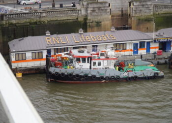 RNLI Tower Lifeboat Station begins its journey to new temporary home under Tower Bridge. (image: RNLI/Hallmark Broadcast)