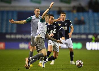 Danny McNamara in action against Ireland colleague James McLean. Photo: Millwall FC