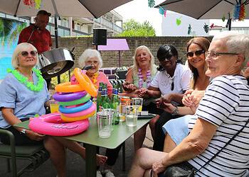 They enjoyed singing to steel band performer Mark Cherrie, a delicious BBQ spread and birthday cake topped with flowers. 