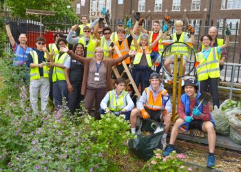 Dulwich College students plant wildflowers at Denmark Hill station for National Meadows Day.