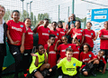 Mike Tomkins, the Chairman of MandM, with footballers at Harris Academy Peckham
