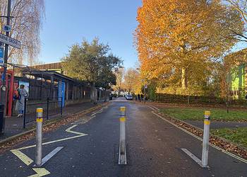 The bollards are manually erected every day for an hour before and after school.