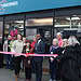 89-year-old Carolina cuts the ribbon at the East Dulwich store alongside Southwark Mayor Michael Situ