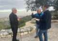 Bishop Christopher Chessun meeting with Israeli attorney Daniel Seidemann with view of of the Jordan Valley and mountains of Moab from the Mount of Olives