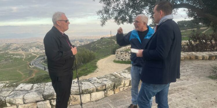 Bishop Christopher Chessun meeting with Israeli attorney Daniel Seidemann with view of of the Jordan Valley and mountains of Moab from the Mount of Olives