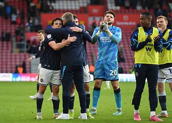 Matija Sarkic (third right) salutes the fans at the end with his team-mates and Neil Harris. Pic - Millwall FC.