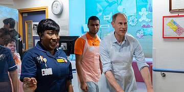 The Duke of Edinburgh gave volunteers a helping hand at King's College Hospital. Credit: King's College NHS Foundation Trust