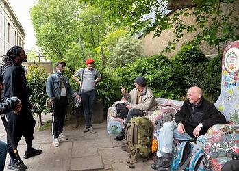 A group of Accumulate participants led by journalist Samir Jeraj on a walk around St John's and the former site of Cardboard City. Credit: Eleanor Bentall