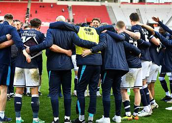 Millwall's players and staff gathered after the final whistle. Image: Millwall FC