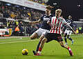 Ryan Leonard and Jack Clarke duelled throughout December's 1-1 draw. Image: Millwall FC