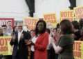Miatta Fahnbulleh (C) alongside former Prime Minister Sir Keir Starmer (L)