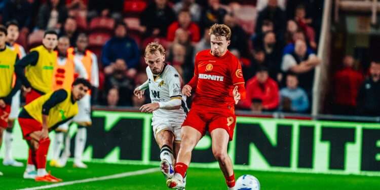 Mark Sykes battles for the ball against Middlesbrough. Image: Millwall FC