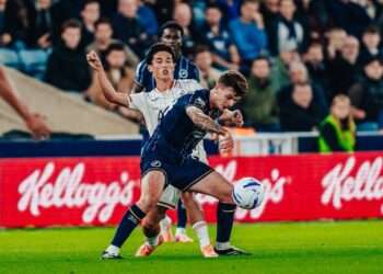 Jenson Metcalfe competes for the ball against Swansea City. Image: Millwall FC